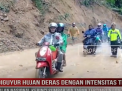 DIGUYUR HUJAN DERAS DENGAN INTENSITAS TINGGI, JALAN NASIONAL KERINCI SUMBAR VIA TAPAN TERTIMBUN