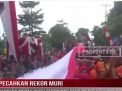 PECAHKAN REKOR MURI, BENDERA MERAH PUTIH SEPANJANG 2500 METER KELILINGI KOTA BUNGO